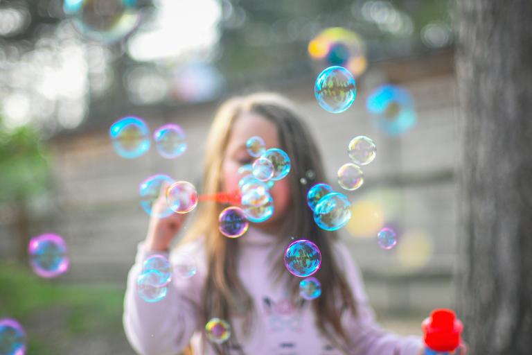 Child blowing bubbles