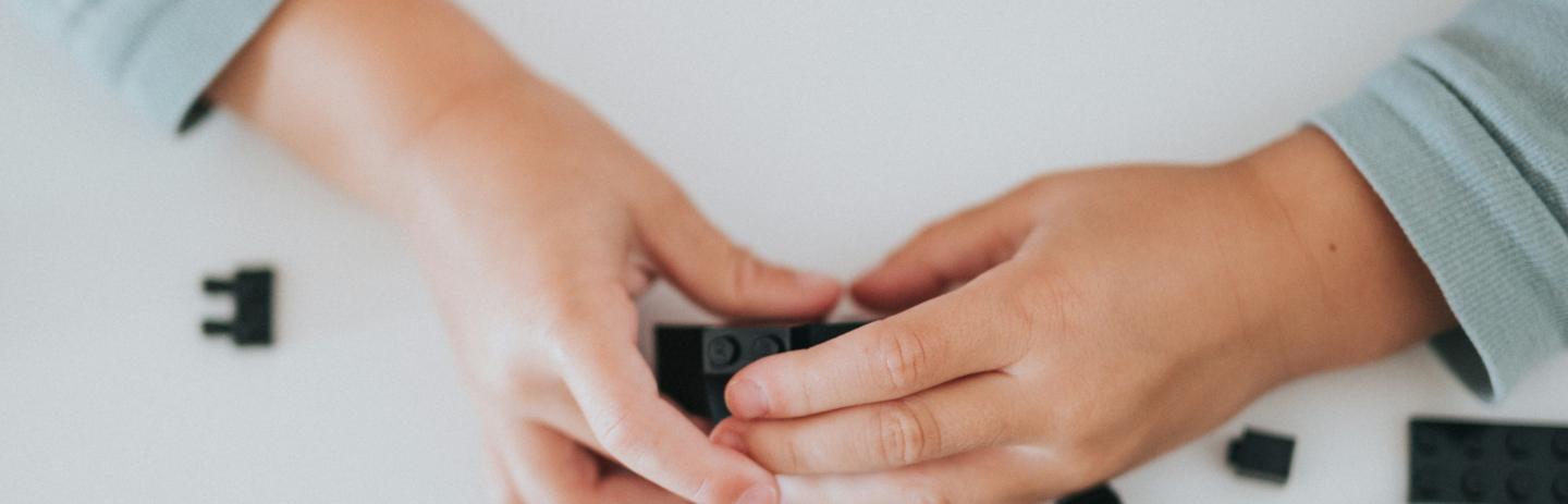 Child playing with lego