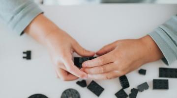 Child playing with lego