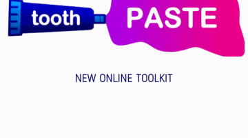 toothpaste tube with the word tooth written on it and PASTE coming out of the top